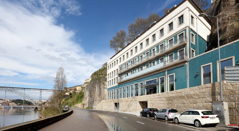 Outside building of the Eurostars Porto Douro Hotel with view to Douro River and Ponte Luis I